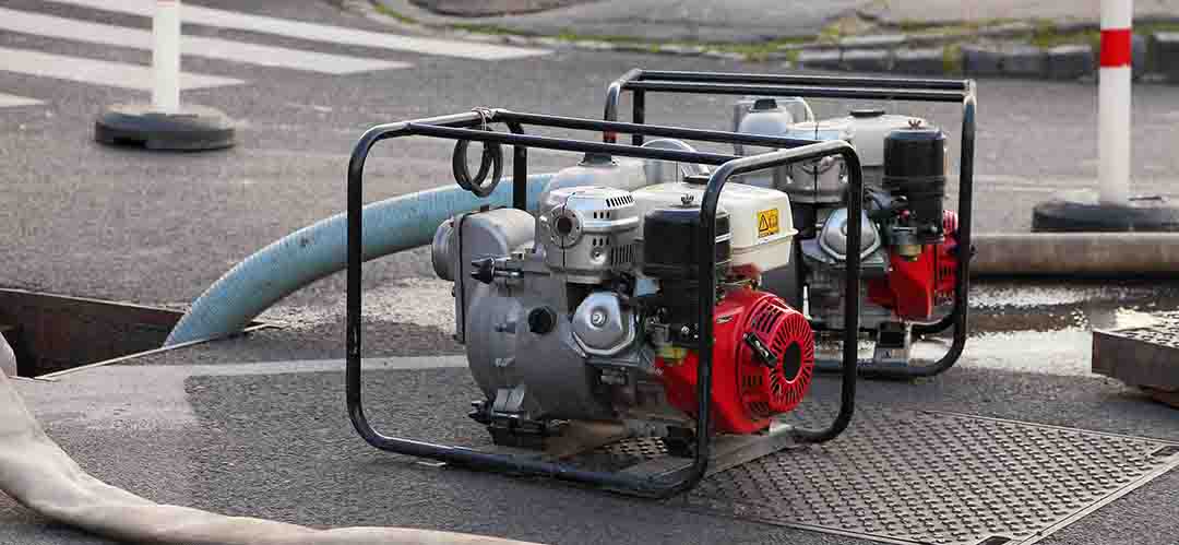 Motor connected to a construction pump and generator for rugged jobsite applications