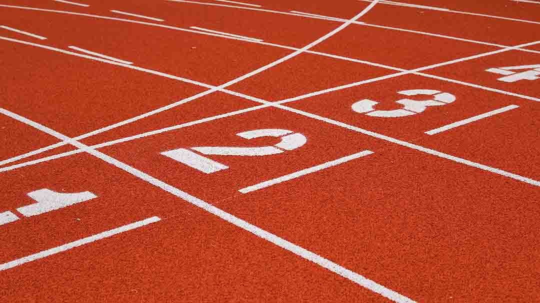 Running track with lane markings used for sports and recreation applications