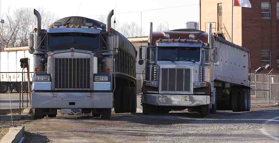 Semi trucks driving on road